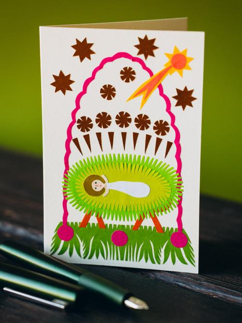 kartka wycinanka świąteczna na zielonym tle