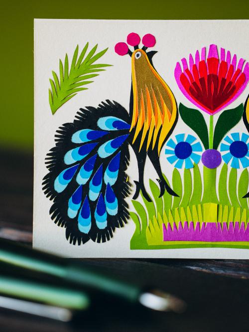 paw z niebieskim ogonem na kartce